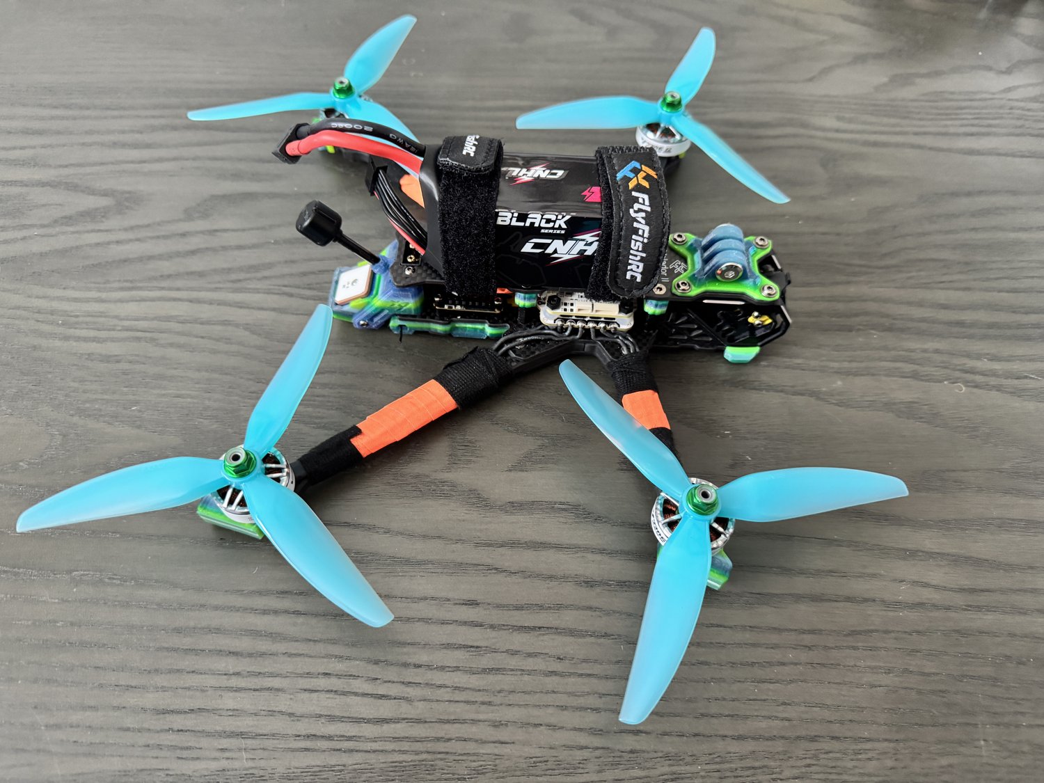Actual Sasquatch catalog photograph. Cyan props, orange arm wraps and green/blue TPU identify this build.