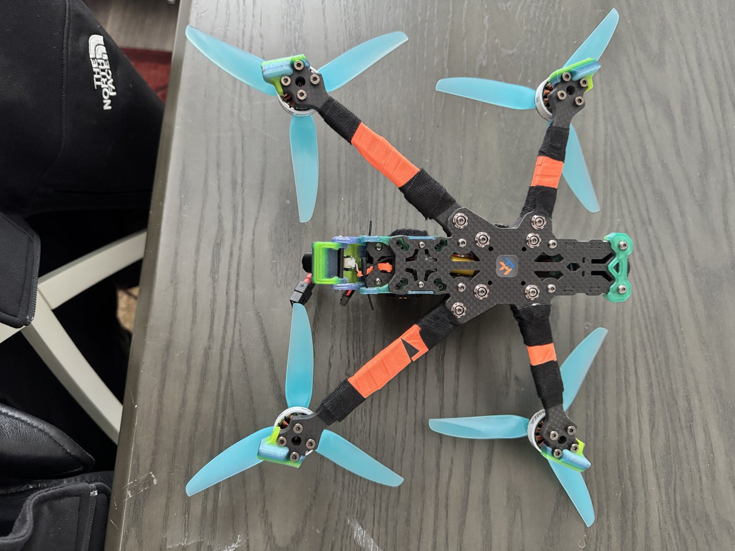 Underside view: inspect the carbon, fasteners and wiring. This is not the top-view orientation used in the rotation diagram.